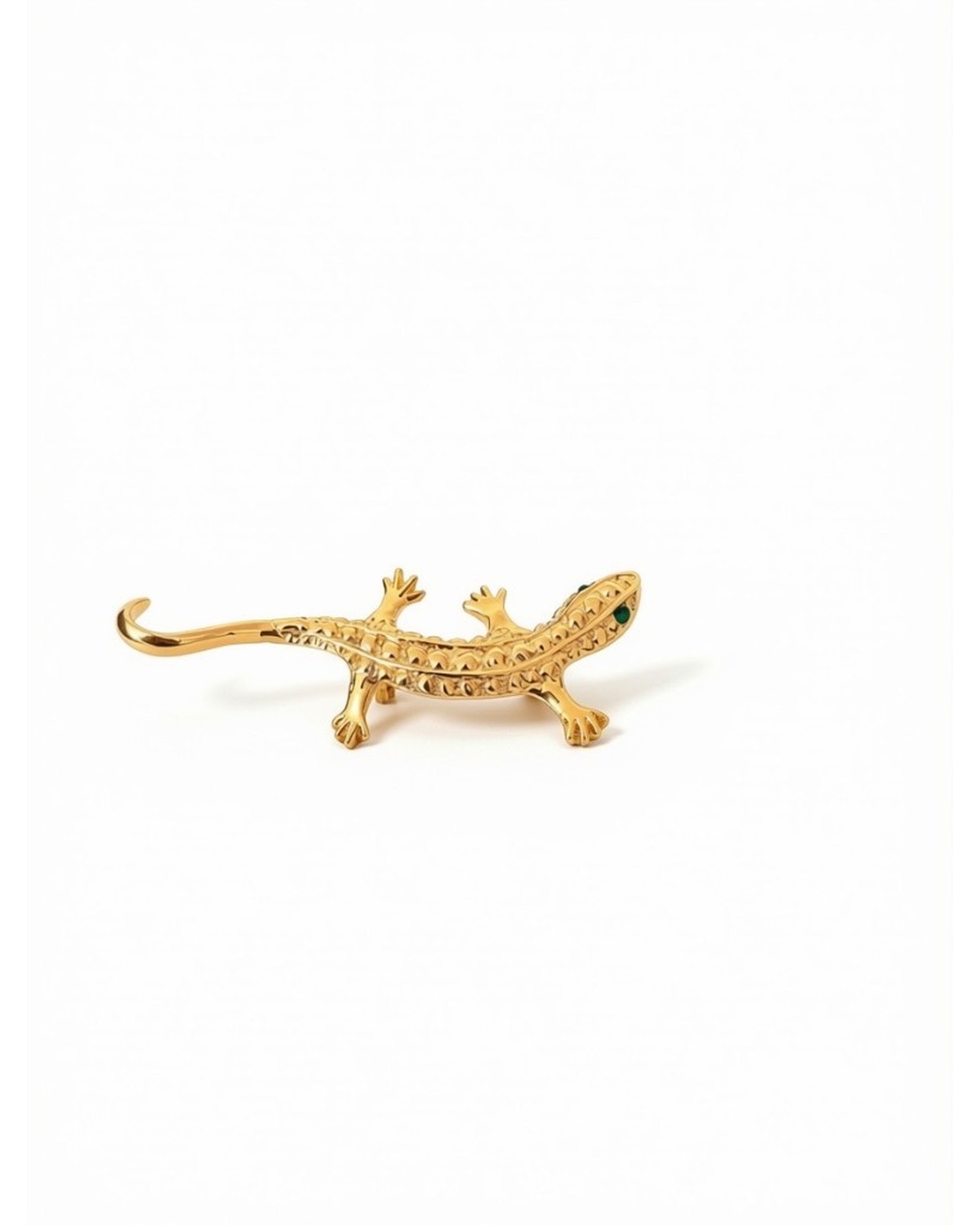 Gold-tone lizard brooch with green eye