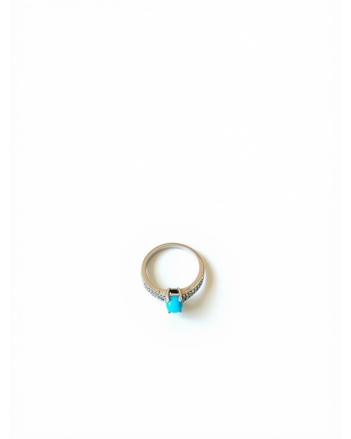 Silver ring with turquoise cabochon and engraved band